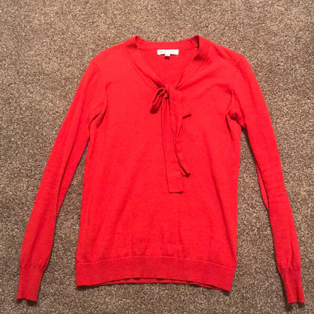 Red sweater with bow detail